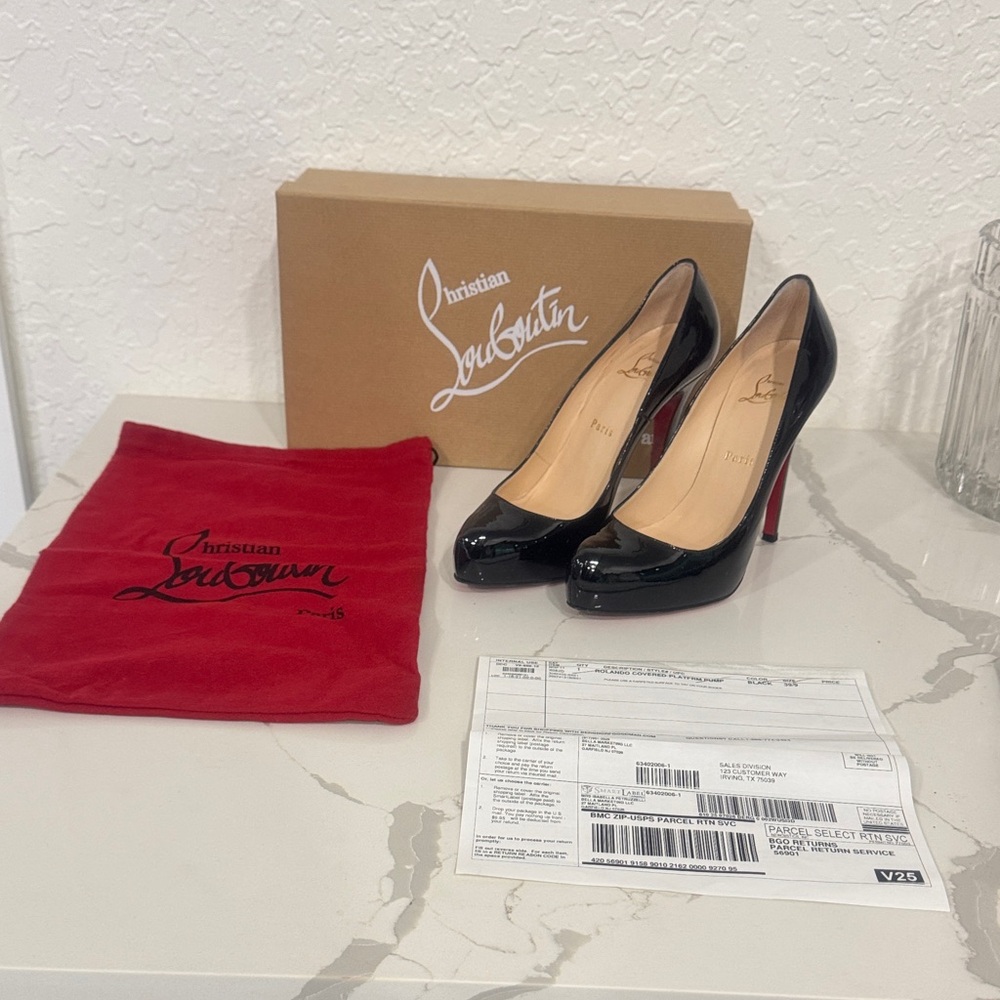 Authentic Christian Louboutin Glossy Black Heels with Red Soles.
